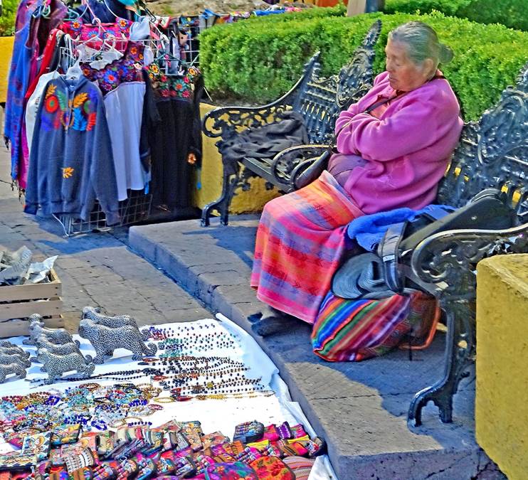 A picture containing outdoor, person, marketplace

Description automatically generated
