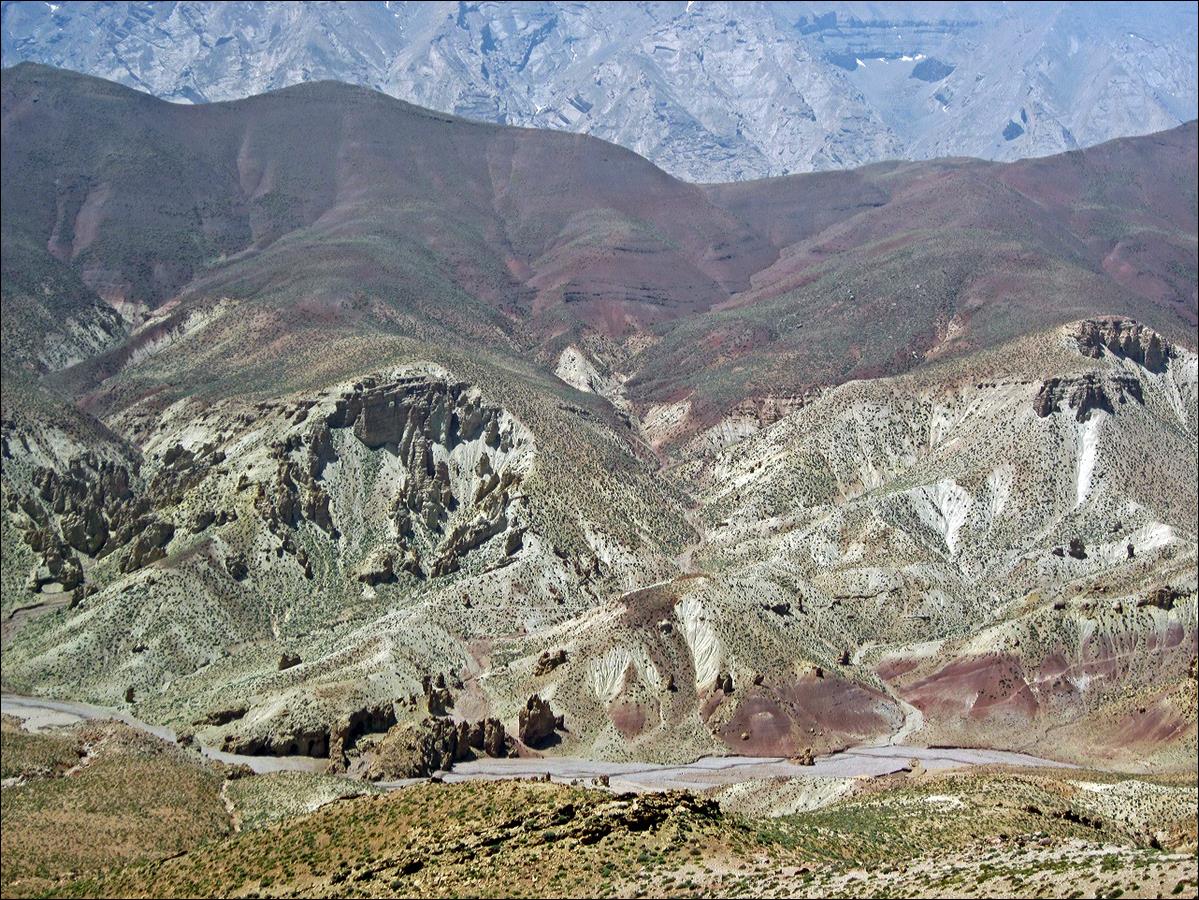 A landscape of a mountain range

Description automatically generated