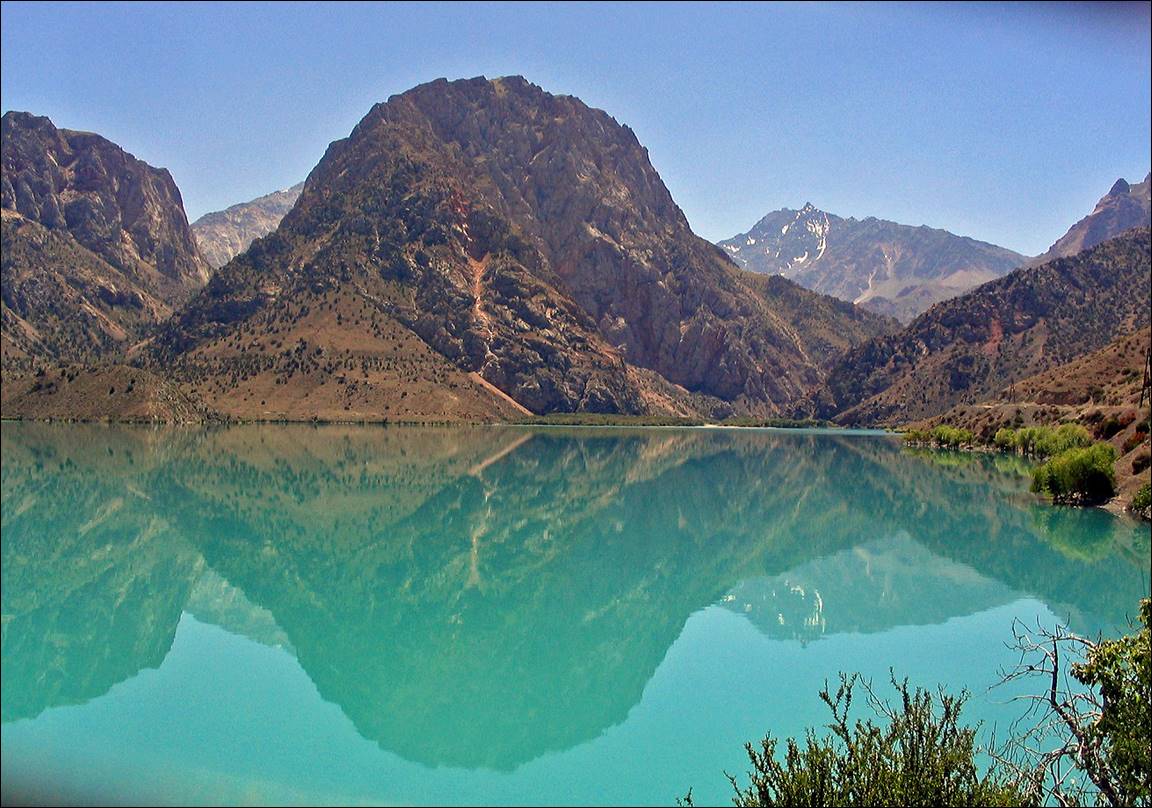 A mountain range reflected in a lake

Description automatically generated