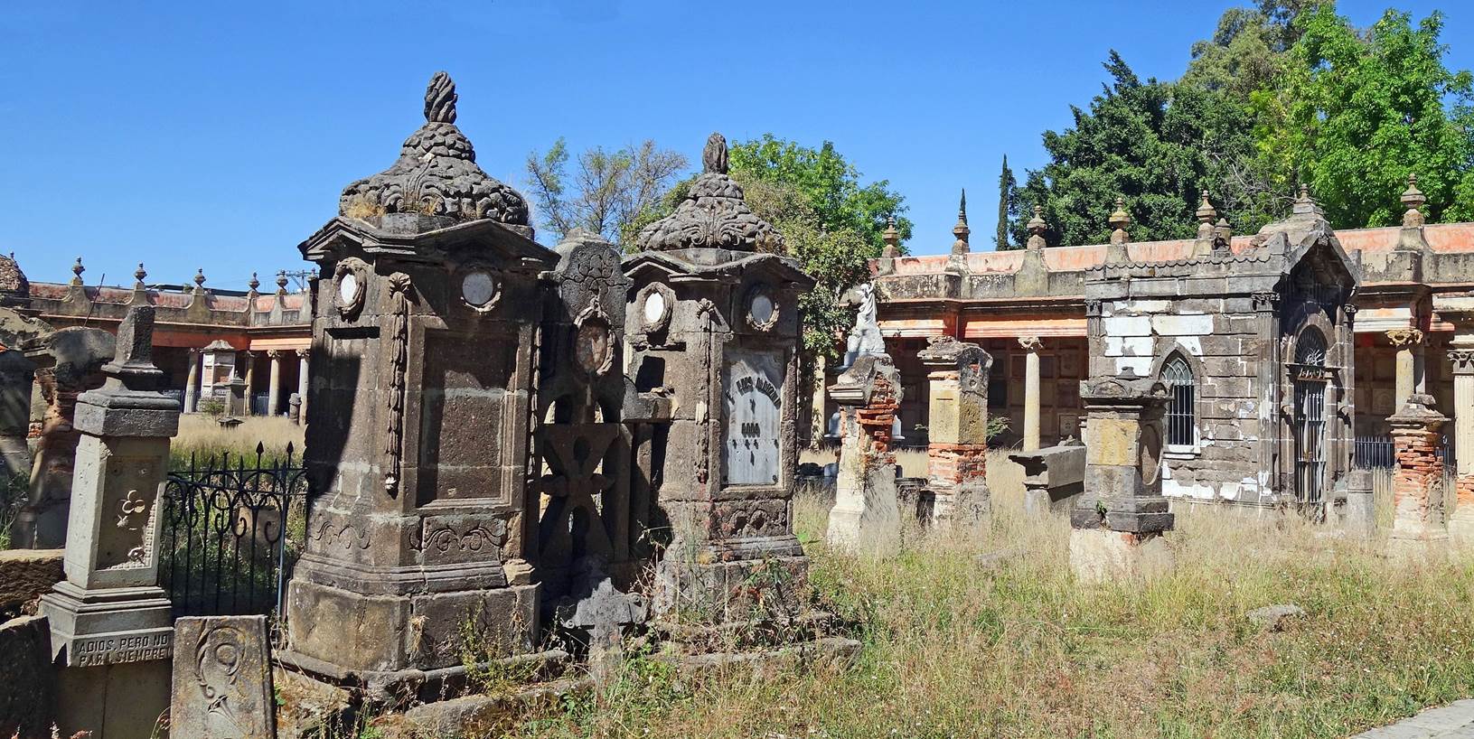 A cemetery with many old stone statues

Description automatically generated with medium confidence