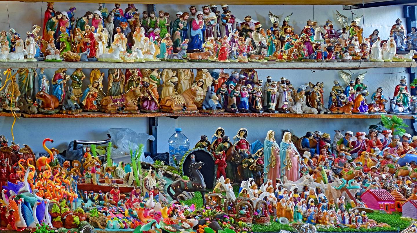 A group of figurines on a shelf

Description automatically generated with medium confidence