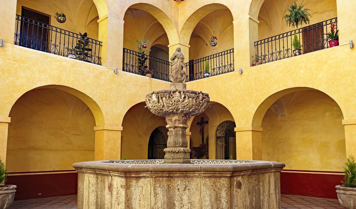 A fountain in front of a building

Description automatically generated with medium confidence