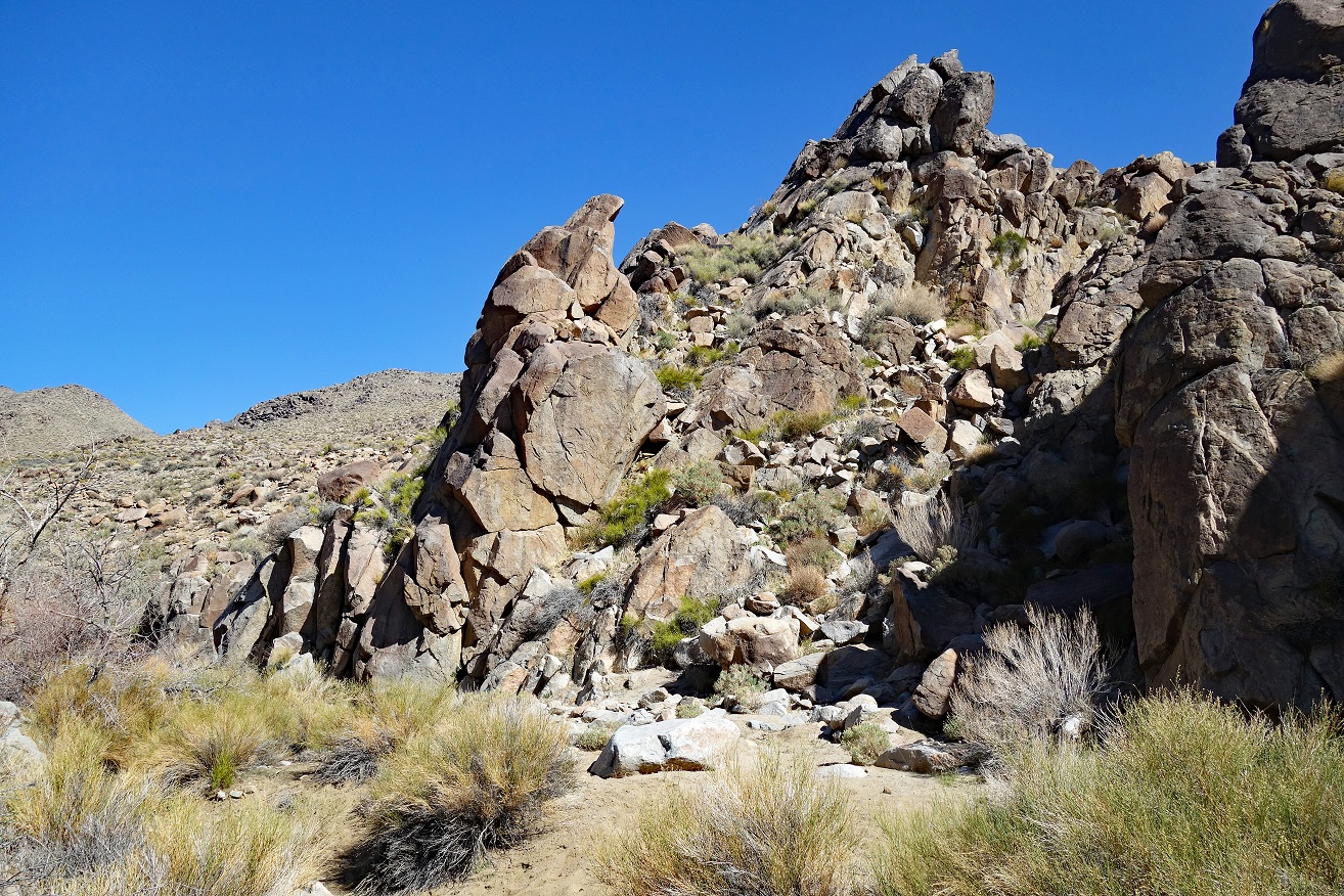 A picture containing rock, outdoor, mountain, sky

Description automatically generated