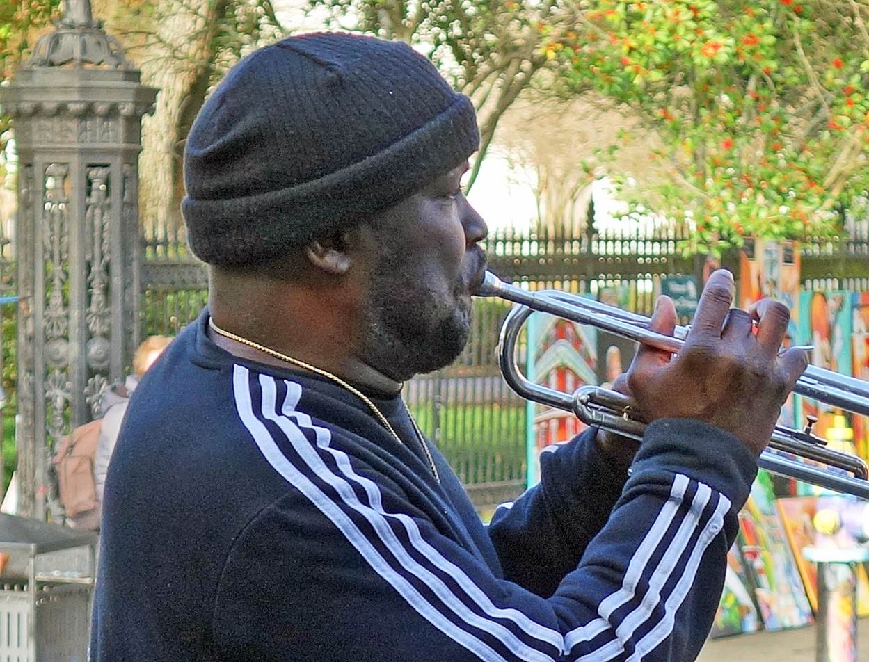 A person playing a trumpet

Description automatically generated with medium confidence
