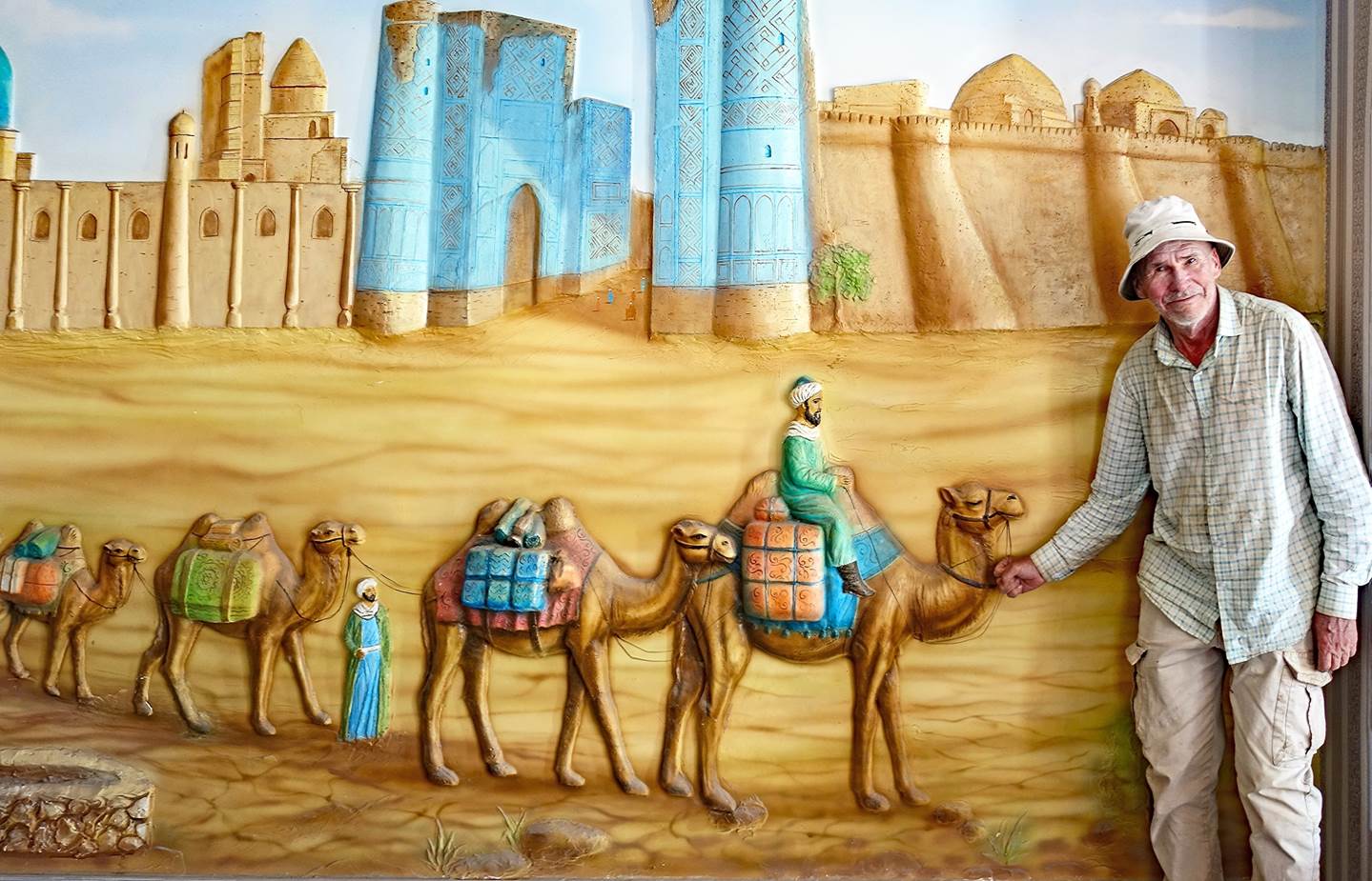 A mural of a person with camels

Description automatically generated