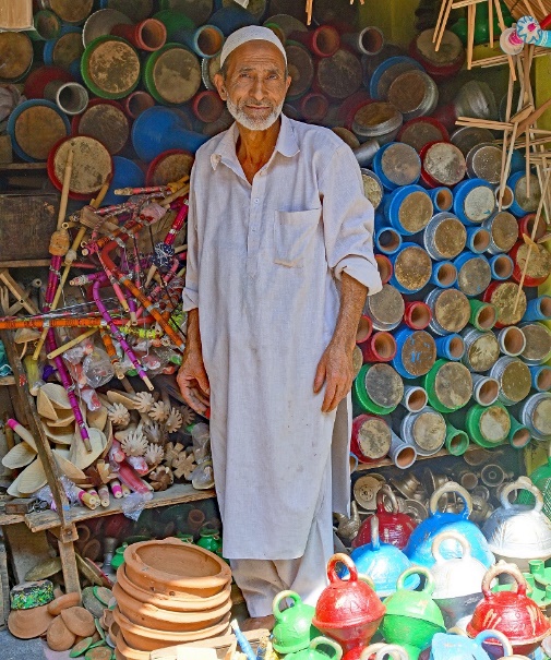 A picture containing person, marketplace, colorful, shop

Description automatically generated