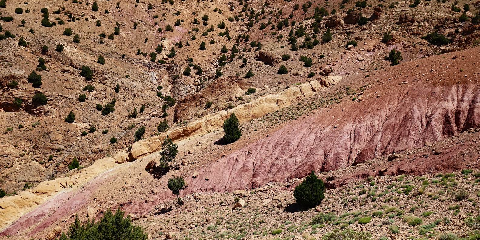 A picture containing outdoor, mountain, geology, badlands

Description automatically generated