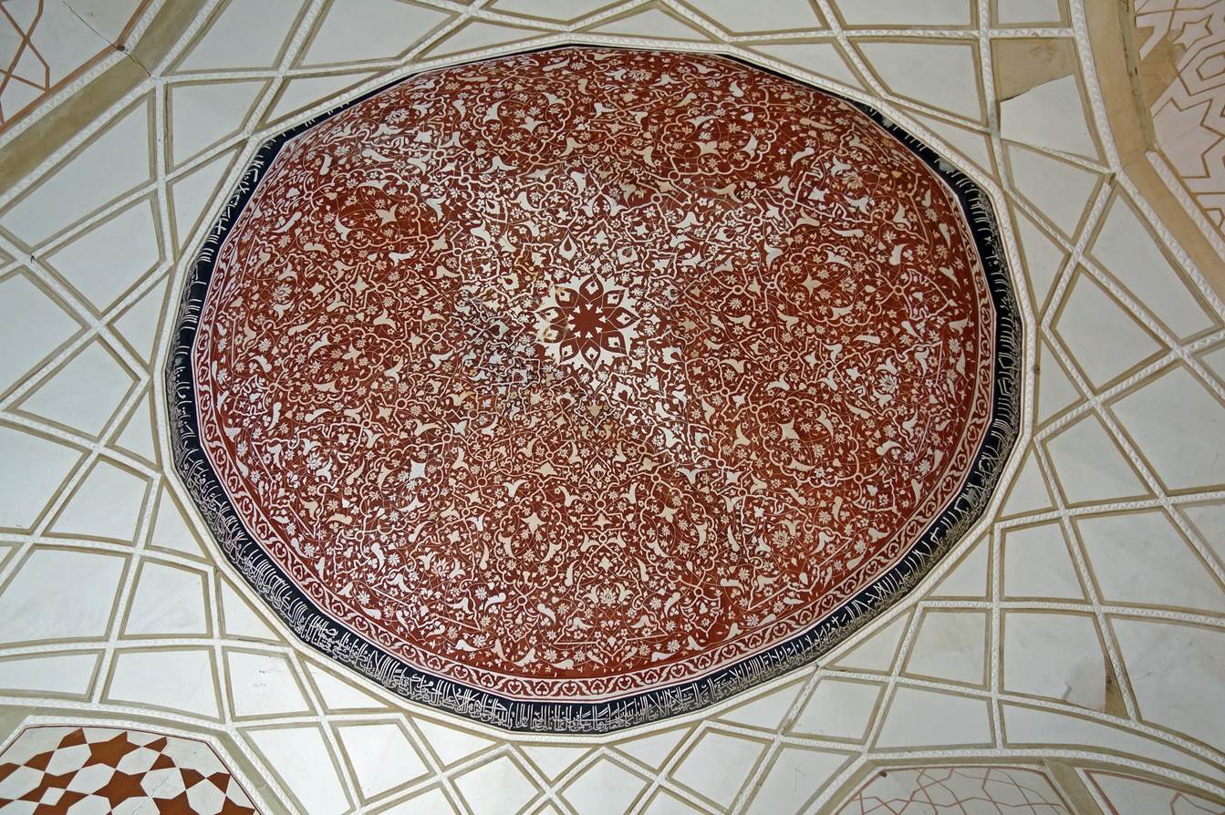 A circular rug on a white surface

Description automatically generated